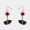 Boucles d’oreilles Ginkgo doré Doly en bois d’Amarante et métal doré, design artisanal unique pour toutes les occasions.