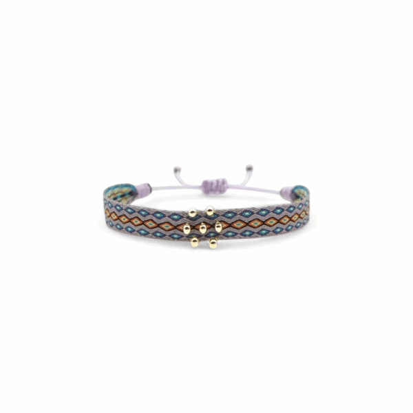 Bracelet colombien Alisson fait main – tissage violet, jaune, orange et bleu avec perles argentées, bijou bohème artisanal.