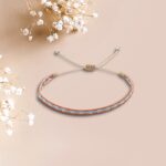 Bracelet colombien Paola – bijou fait main orange, beige et bleu en tissage artisanal bohème